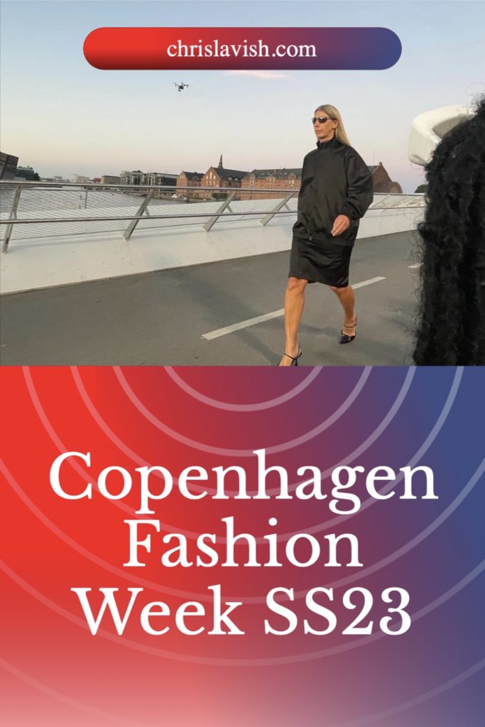 Blonde Nordic model wearing black long sleeve dress walking on a bridge in Copenhagen at sunset with title Copenhagen Fashion week ss23